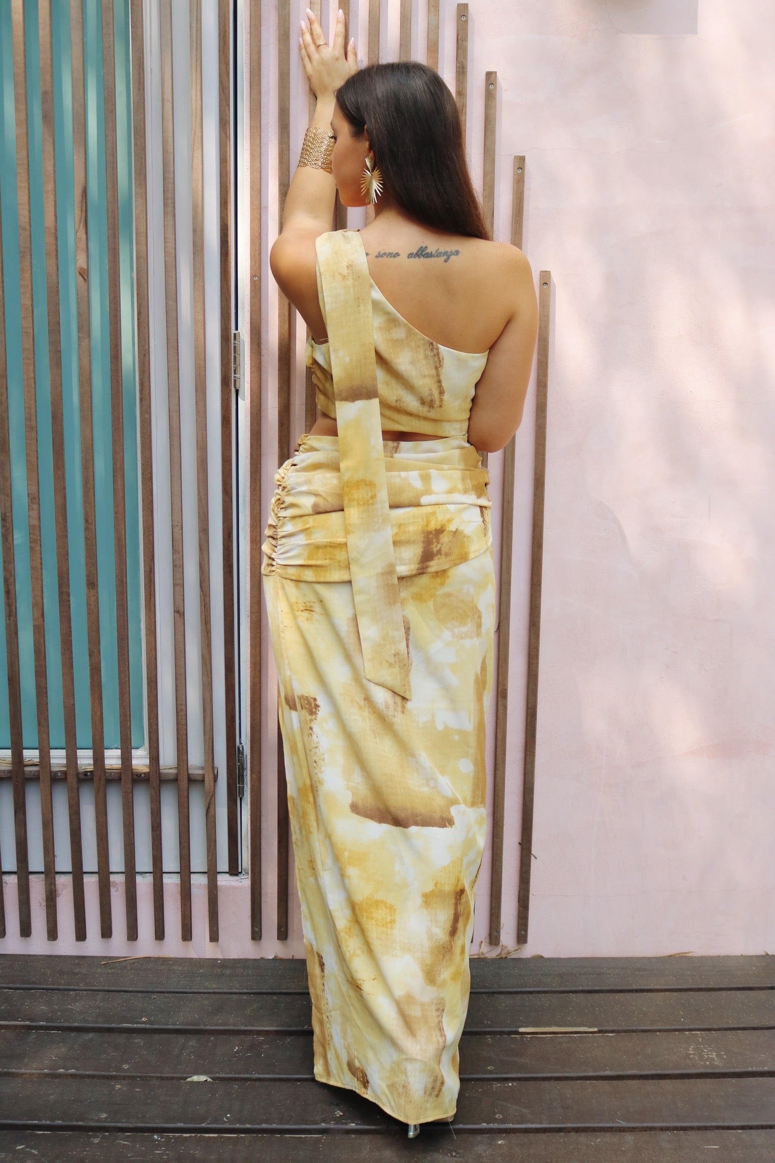 'Anastasia' One Shoulder Cut Out Bow Tie Dress in Gold Print. Scarlette The Label, an online fashion boutique for women.