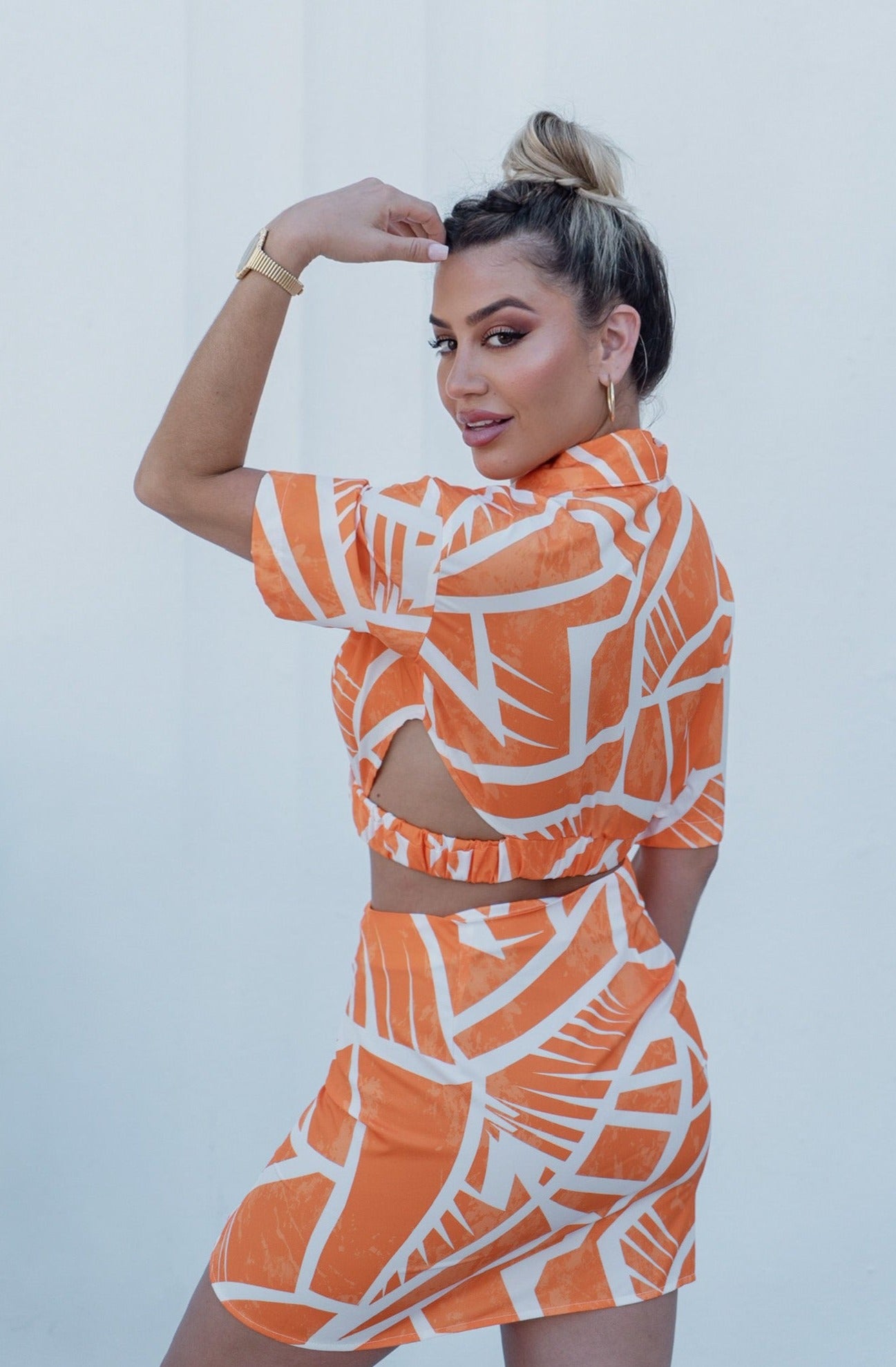 'Charlotte' Collared Button Down Cut Out Top and Mini Skirt Set in Orange Print. Scarlette The Label, an online fashion boutique for women.