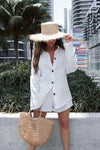 Cotton linen vacation short set in white for Scarlette The Label, an online fashion boutique for women. Lack of Color straw hat and large wooden handbag.