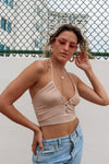 Criss Cross Crop Top Tank in Taupe from Scarlette The Label, an online fashion boutique for women. Paired with light wash denim jeans, gold hoops, and sneakers.