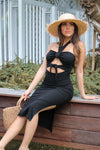 Ribbed cutout Tie Halter Dress in Black at Scarlette The Label, an online fashion boutique for women. Straw Lack of Color Hat and large wooden bag.