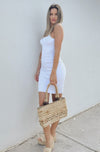 The Maison Ribbed Mini Dress in White sold at Scarlette The Label, an online fashion boutique for women. Resort Wear Collection 2021.